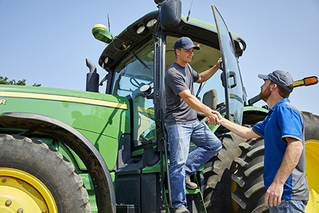 Tractor_farmer_adjuster_handshake_feature